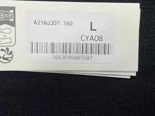 Framed view of the source tag showing the size marking L and printed item code